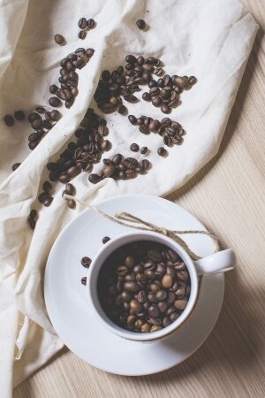 Coffee Beans in a Coffee Cup Free Mobile Wallpaper