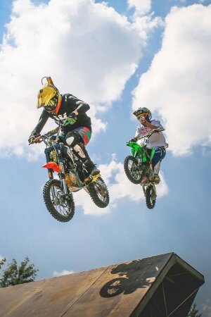 Two Crazy Jumping Pitbikers Mobile Wallpaper